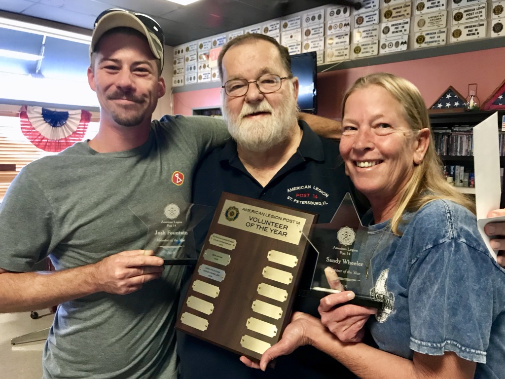 Post 14's 2019 volunteer recognition, with award recipients and the Volunteers of the Year plaque.